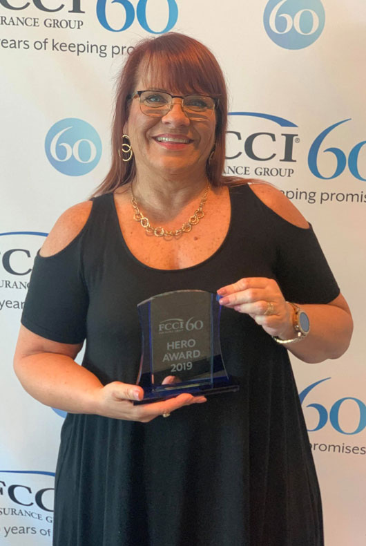 Renee receiving the FCCI Hero Award