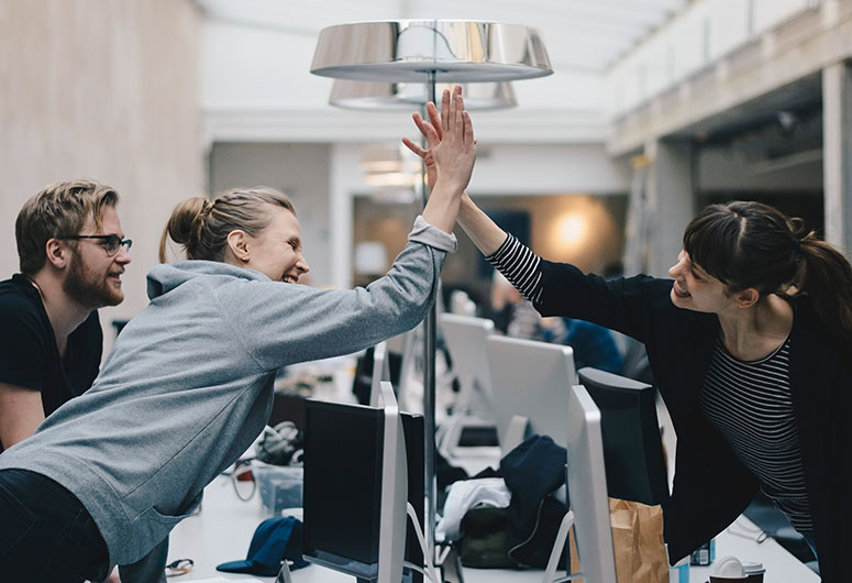 Workers high-five 